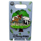 A Disney Pins Earth Day 2023 enamel pin featuring Bambi and Flower the skunk under a tree, mounted on a light blue display card with Disney Pins branding.